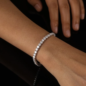 Close-up of S925 sterling silver tennis bracelet with brilliant round-cut moissanite stones