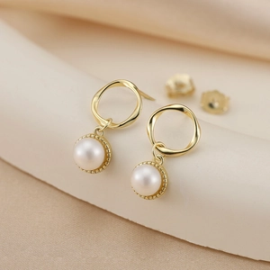 Elegant 5.5mm pearl earrings with geometric gold hollow design and S925 silver studs