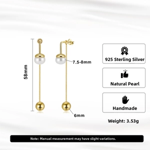 Detailed view of 58mm silver tassel earrings with 7.5-8mm natural pearls and gold plating
