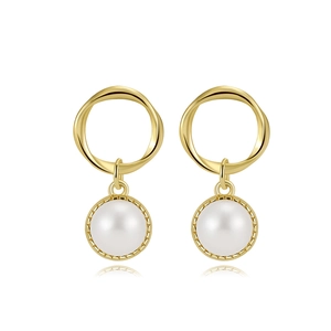 Close-up of 5.5mm pearl earrings with twisted gold hoops and gear-like edges