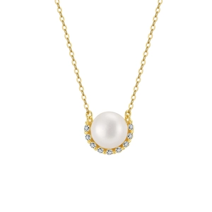 Close-up of elegant pearl pendant with gold plating and sparkling zircon stones on a thin chain
