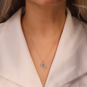 Detailed view of a gold S925 silver necklace with a six-prong crown zircon pendant