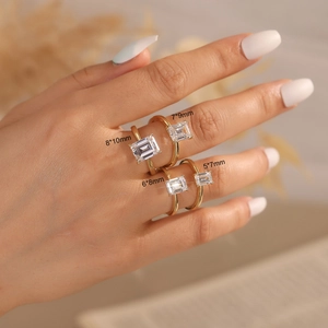 Detail of S925 sterling silver rings set with rectangular moissanite stones in four sizes
