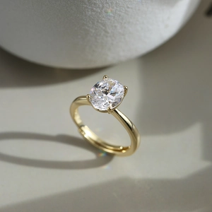 Macro detail of oval-cut zircon ring in gold-plated four-prong adjustable setting
