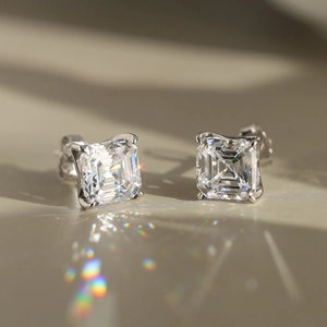 Macro shot of princess cut cubic zirconia stud earrings with silver four-prong setting