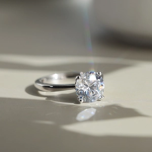 Classic silver four-prong solitaire ring with a brilliant round-cut sparkling cubic zirconia