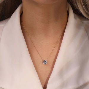 Close-up of S925 sterling silver necklace with a sparkling solitaire round-cut zircon