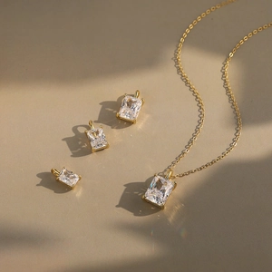 Elegant gold necklace with rectangular geometric cubic zirconia pendants in various sizes