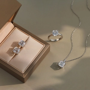 Macro detail of 925 silver jewelry set with square cut stones in a luxury gift box