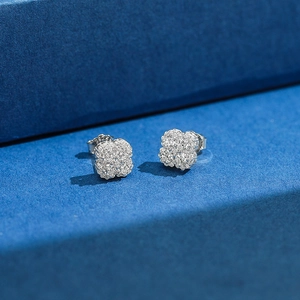 Macro shot of S925 sterling silver clover stud earrings with sparkling pavé setting