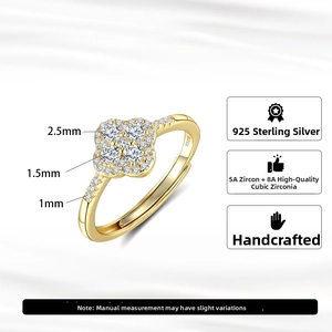 Detail of silver clover ring showing S925 hallmark and high-grade zirconia settings