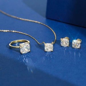Elegant gold S925 silver jewelry set with cushion-cut stones and clover details