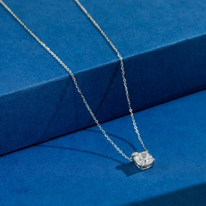 Elegant S925 silver necklace with square four-prong pendant on dark textured background
