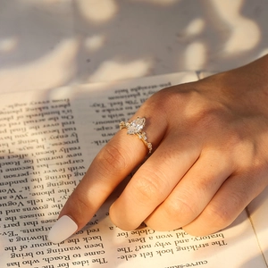 Elegant s925 gold-plated ring with marquise-cut zircon shown on a model's finger