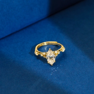 Macro detail of marquise-cut zircon ring in gold finish with adjustable band