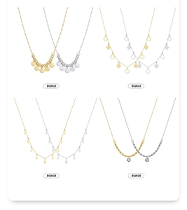 Detail view of S925 sterling silver necklaces set with geometric discs and clover charms