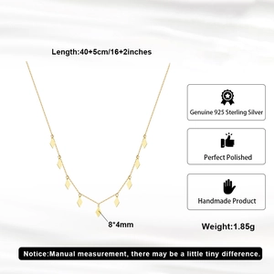 Close-up of S925 sterling silver long necklace with geometric rhombus pendants in gold