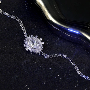 Macro detail of S925 sterling silver evil eye bracelet with marquise cut crystal inlay