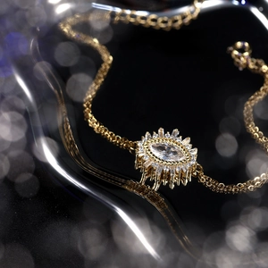 Detailed shot of an adjustable S925 silver Evil Eye bracelet with sparkling zircons