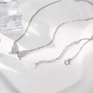 Elegant S925 sterling silver butterfly pendant necklace with glowing blue aurora stone