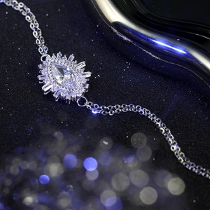 Macro detail of S925 sterling silver evil eye bracelet with marquise cut crystal