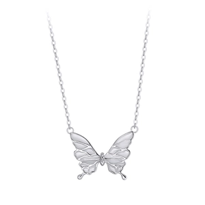 Detailed view of silver butterfly pendant with white enamel inlay on delicate chain