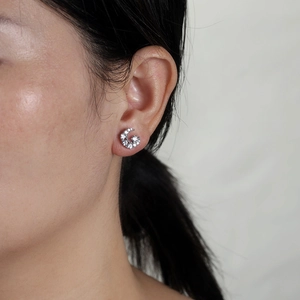 Sparkling silver letter G stud earring with cubic zirconia pave on female model
