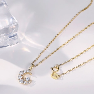Luxurious S925 sterling silver gold-plated moon necklace featuring sparkling cubic zirconia