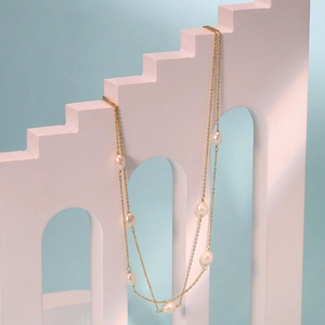 Elegant multi-layered S925 silver necklace with baroque pearls on a gold-plated chain