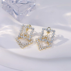 Exquisite gold geometric square stud earrings with sparkling cubic zirconia on a pedestal