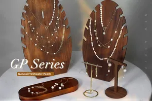 Detail view of GP Series natural freshwater pearl necklaces and earrings in gold finish