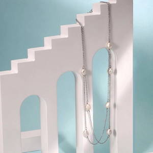 Elegant multi-layer S925 silver long necklace with baroque pearls on geometric backdrop