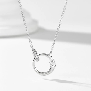 S925 sterling silver interlocking double ring necklace with zircon pavé on white background