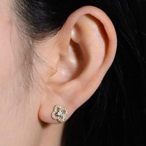 Elegant s925 silver gold clover stud earrings with sparkling zircon inlay on woman ear