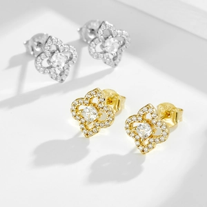 S925 sterling silver four-leaf clover stud earrings with hollow design and zircons