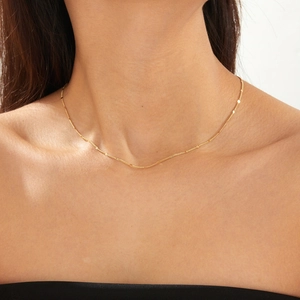 Minimalist S925 sterling silver gold plated necklace with flat round discs on female model