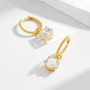 Elegant gold twisted rope hoop earrings with large clear round cubic zirconia drops