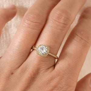 Elegant gold S925 silver halo ring with round zircon gemstone on hand model