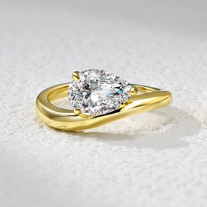S925 sterling silver ring set with pear cut zircon stones in a wave drop design