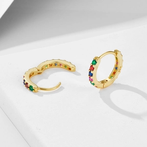 Detailed close-up of rainbow cubic zirconia stones on gold S925 sterling silver hoop earrings