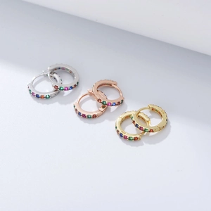 Three pairs of S925 sterling silver huggie hoops with colorful rainbow zircons