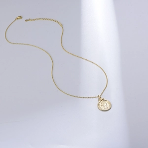 S925 sterling silver gold plated Elizabeth coin relief pendant necklace on gray surface