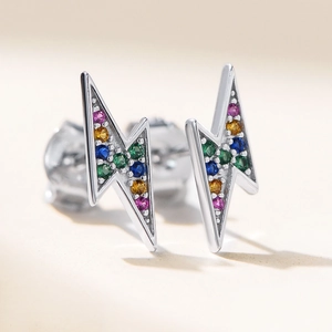 Macro view of S925 silver lightning stud earrings featuring colorful pave zircon stones
