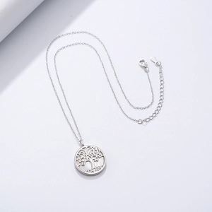 Macro detail of Tree of Life pendant with white mother of pearl inlay on S925 silver chain