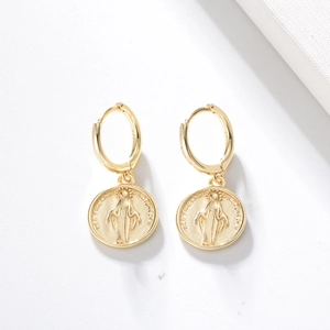 Detail of gold S925 sterling silver hoop earrings with Virgin Mary coin pendant embossed