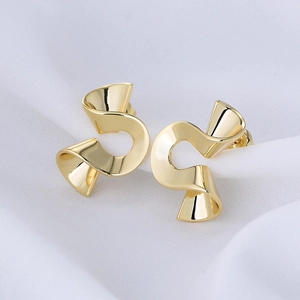 Gold plated irregular spiral earrings with a polished abstract twisted ribbon design