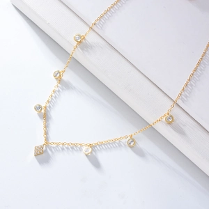 Detail of gold S925 silver choker with round cubic zirconia and rhombus pendant
