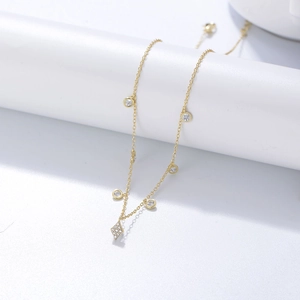 Detail of s925 silver gold choker necklace with diamond rhombus pendant and round zircons