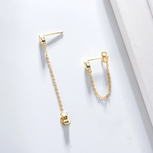 Detail of s925 silver gold chain earrings with drop zircon and unique back-hanging design