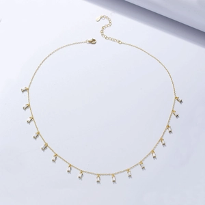 Detail of s925 silver gold necklace with 16 rectangular zircons and adjustable clasp